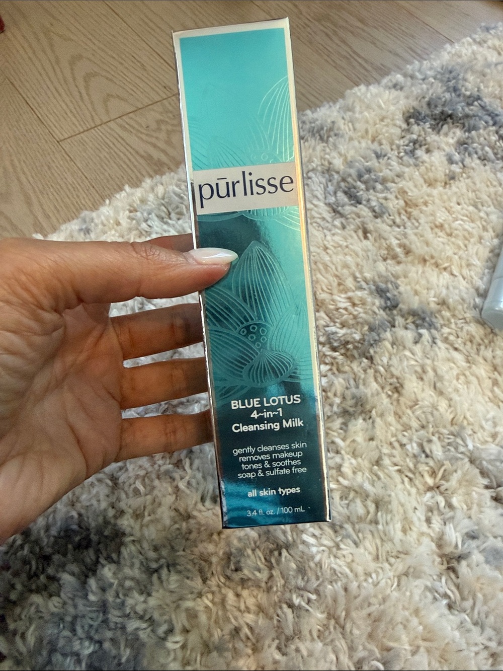 purlisse Blue Lotus 4-in-1 Cleansing Milk — teal blue and white